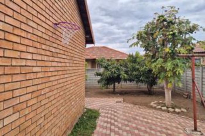 3-Bedroom House For Sale in Ivy Park with garden, garage, and water tank.