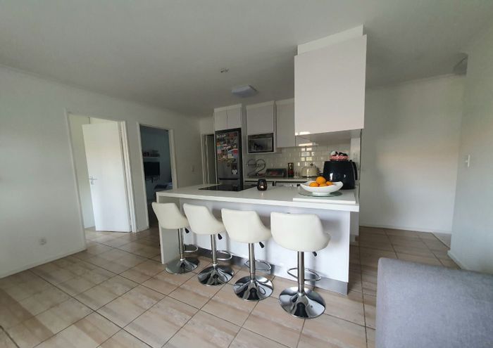 For Sale: Apartment in Pinelands with 2 bedrooms, balcony, and communal pools.