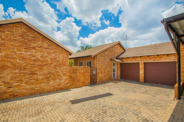 For Sale: Weltevreden Park Townhouse with garden, double garage, and inverter system.