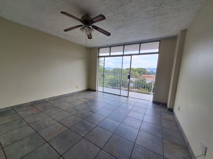 Spacious 3-bedroom apartment in Rietfontein with garage and communal braai area. For Sale.