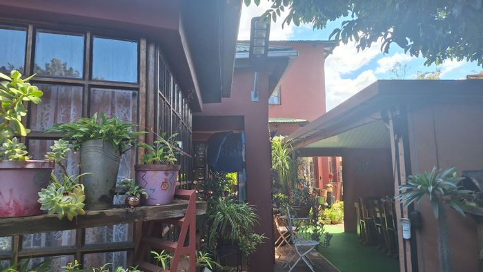 For Sale: Versatile House in Rustenburg Ext 26 with 9 rooms, pool, and offices.