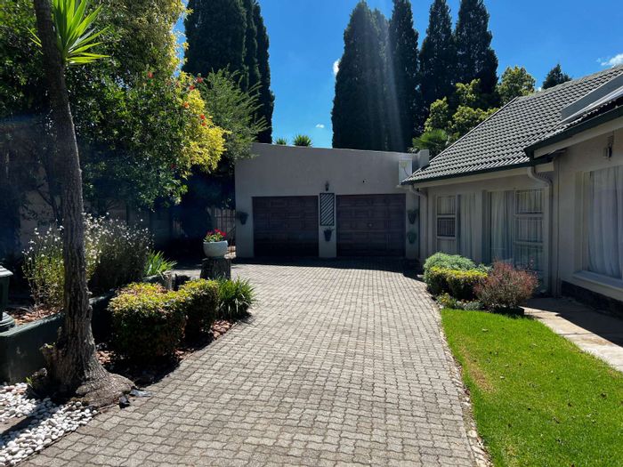 For Sale: Spacious 4-Bed House in Volksrust Central with Flat, Garages, and Security.