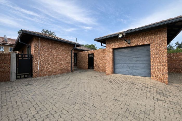 For Sale: Townhouse in Ermelo Central with 2 bedrooms, private courtyards, and garage.