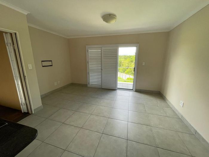 Gonubie Townhouse To Rent: Secure complex, open-plan living, two bedrooms, parking included.