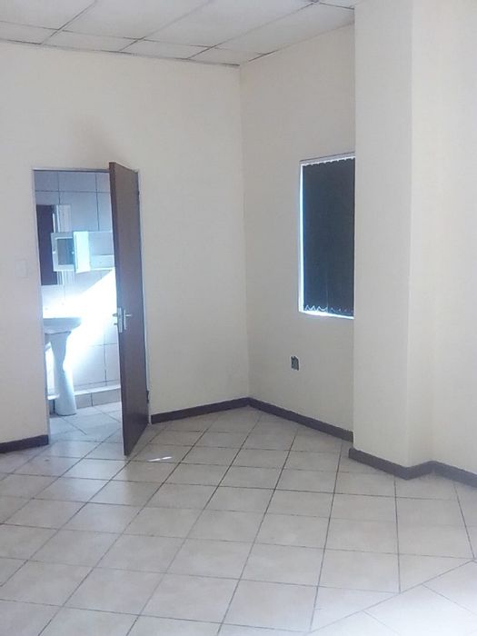 Germiston Central Flat To Rent: Open plan, secure building, near amenities and transport.