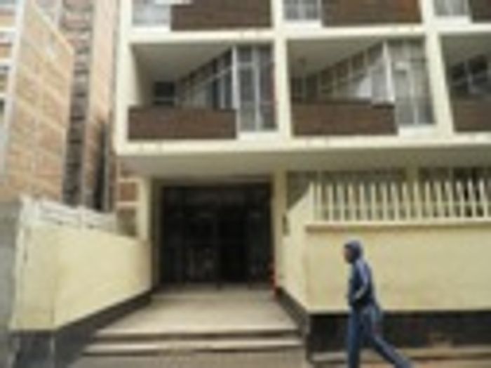 Hillbrow Flat To Rent: Bachelor, close to transport, schools, and shops.