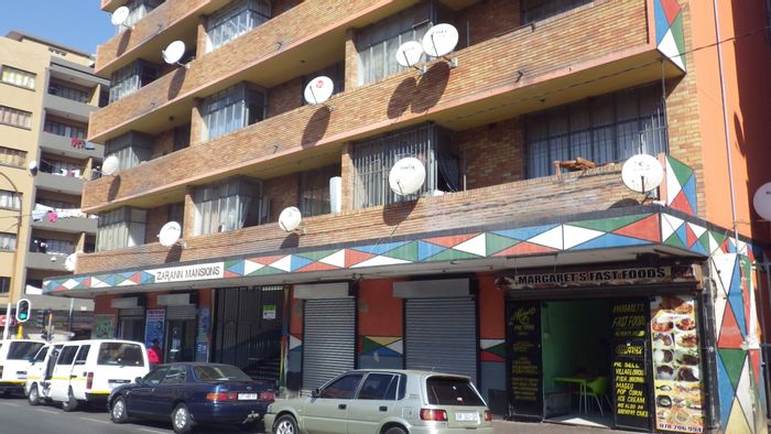 2-Bedroom Flat To Rent in Johannesburg Central with security, amenities, and parks nearby.